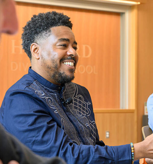Terrence L. Johnson engaged in conversation. 