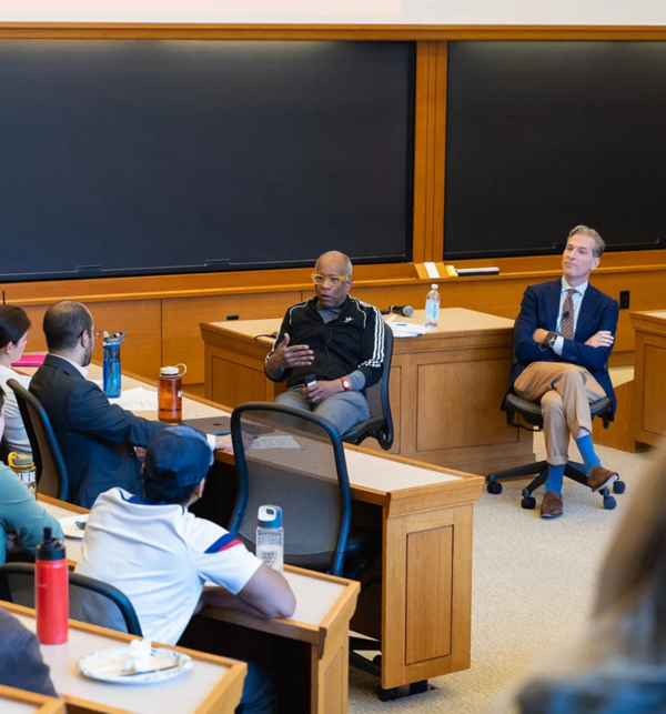 Noah Feldman and Randall Kennedy answer questions from community members during an event.