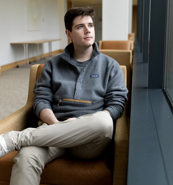 Gavin Lindsey sits looking out a window  by Veasey Conway/Harvard Staff Photographer