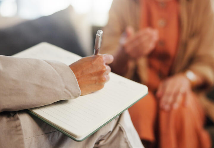 People engaged in a therapy appointment.