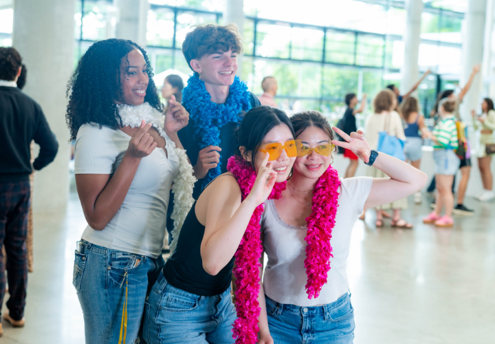 Four Harvard community members pose for a picture at a CCL photobooth.