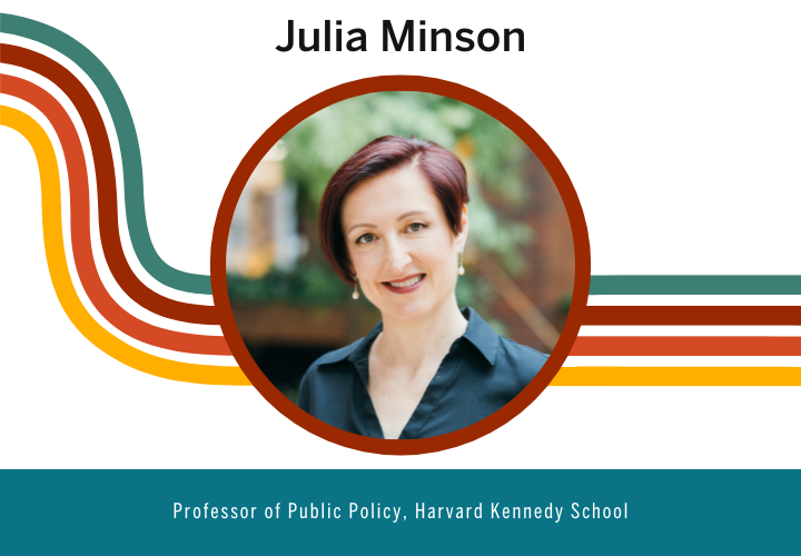 Julia Minson sporting a red bob and dark collared shirt.