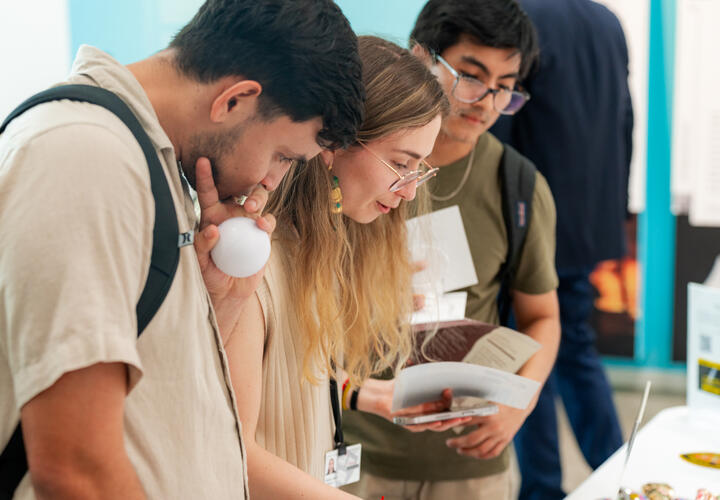 Harvard community members at a resource table. 