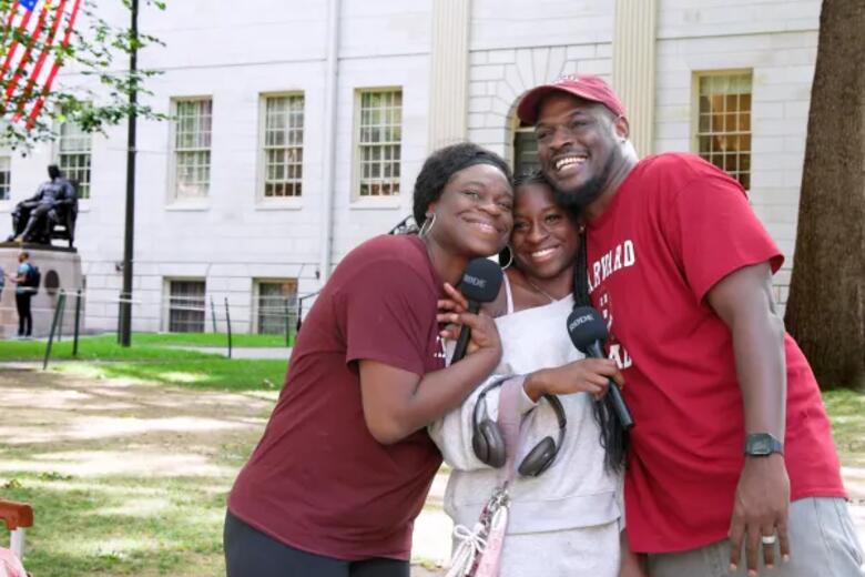 A Harvard student and her family on move in day in Harvard Yard. 