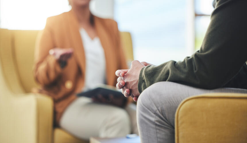 Two people in discussion during an appointment.