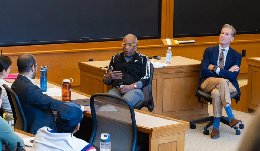 Noah Feldman and Randall Kennedy answer questions from community members during an event.