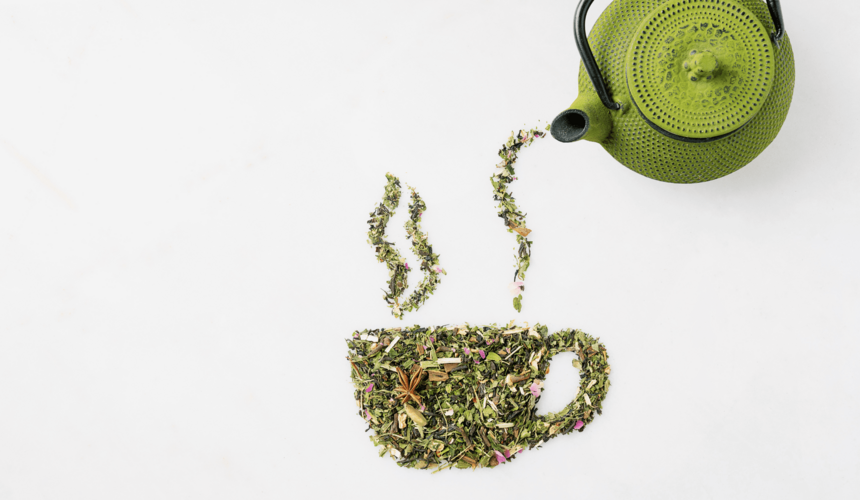 A teapot pours tea into tea leaves arranged in the shape of a teacup.