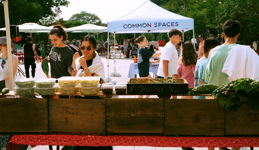 Attendees at the Common Spaces Open Market outdoor stalls.
