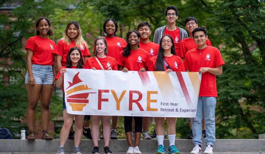 FYRE students holding up a banner