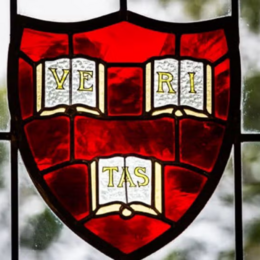 A stained glass Harvard veritas shield.